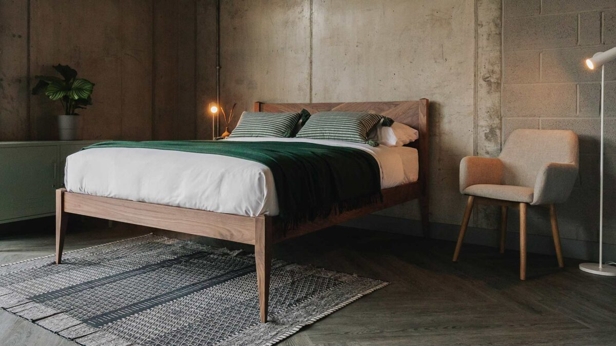 walnut dalston bed with green throw
