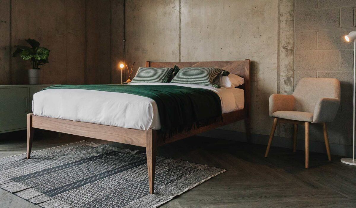 walnut dalston bed with green throw