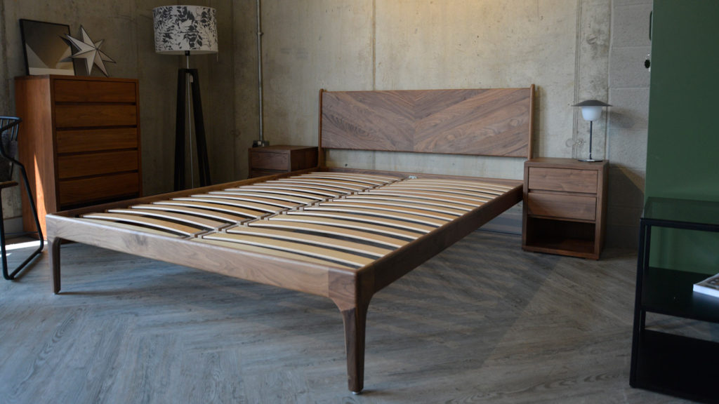 A view of the Walnut retro Hoxton bed frame without mattress and showing the sprung beech slats.