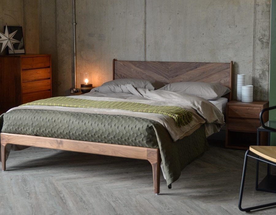 Hoxton contemporary wooden bed with striking chevron headboard and made in Walnut.