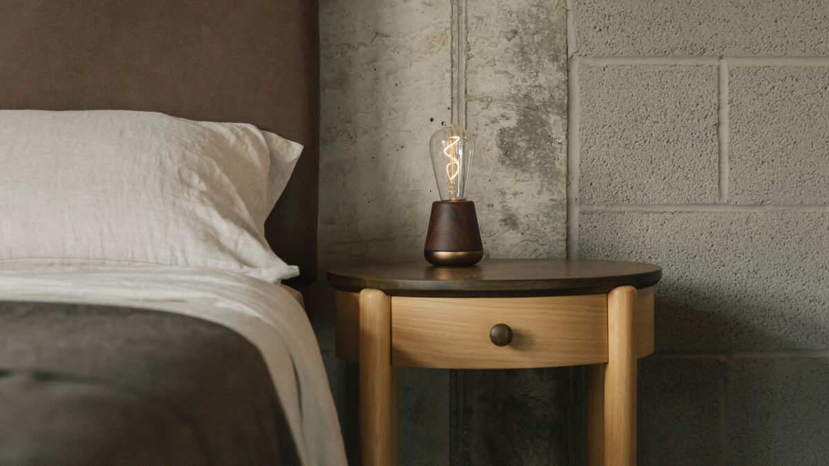 walnut humble light on round bedside unit