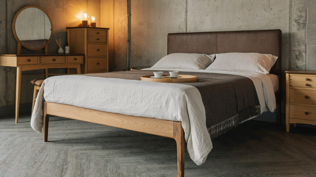 mid century style bedroom featuring a walnut Bloomsbury Bed with faux leather headboard