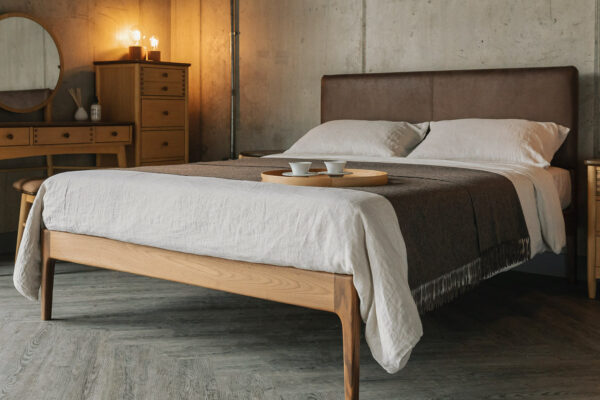 mid century style bedroom featuring a walnut Bloomsbury Bed with faux leather headboard