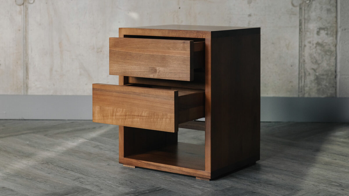 solid walnut wood two drawer bedside tables with open shelf at the top and with the drawers shown open