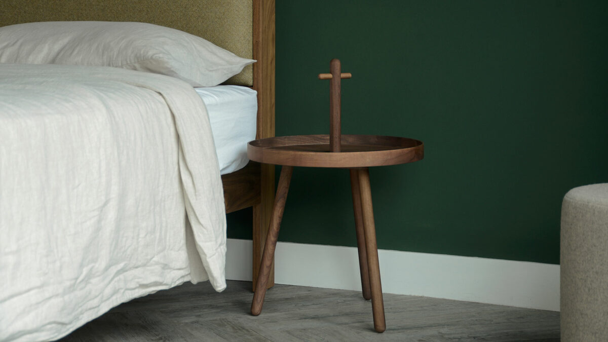 walnut wood tray table with handle used as bedside table