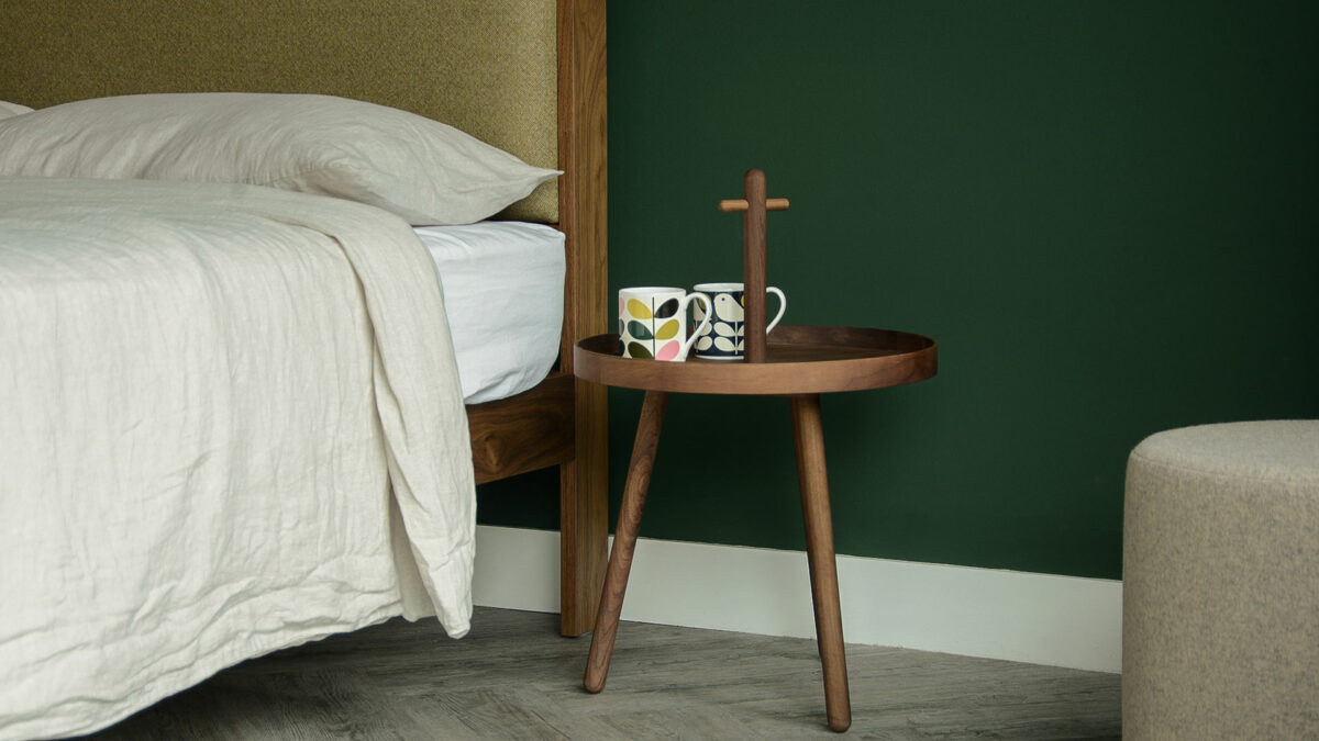 walnut wood tray table with handle used as bedside table