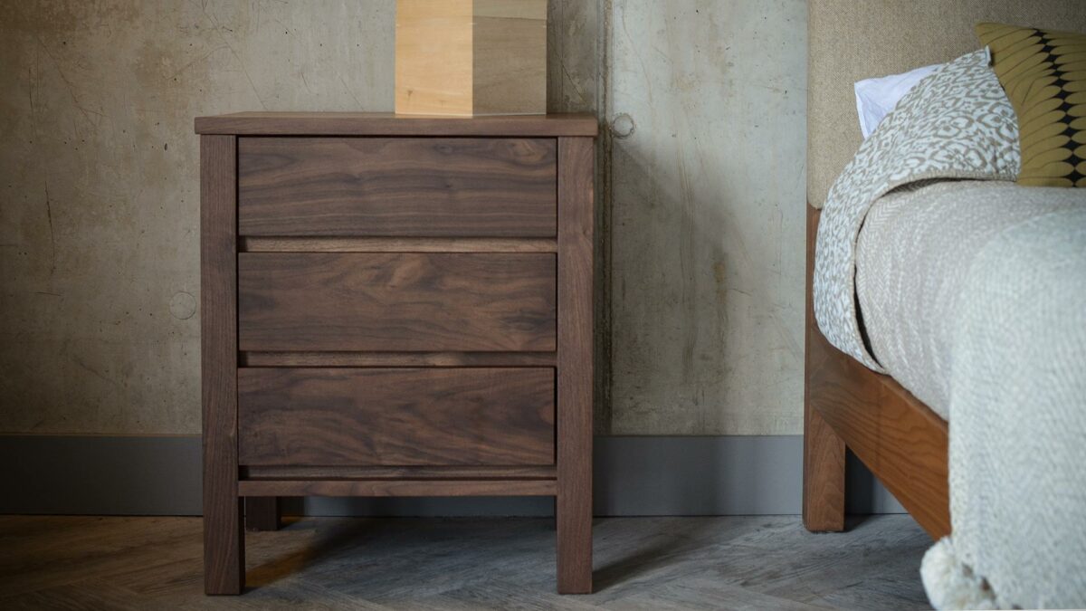 walnut three drawer bedside unit