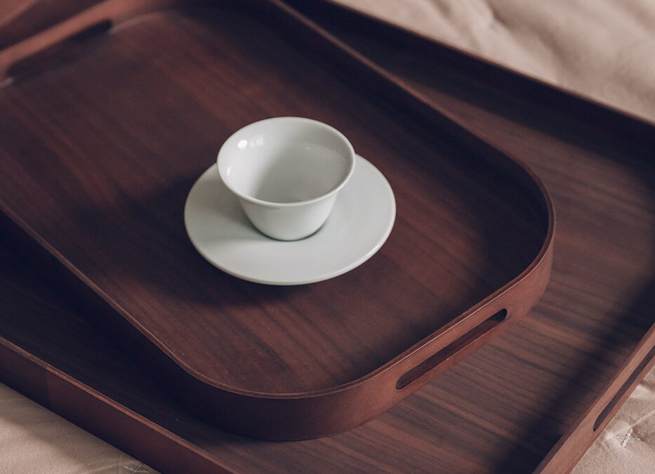 rectangular walnut trays with rounded edges and a handle in the rim