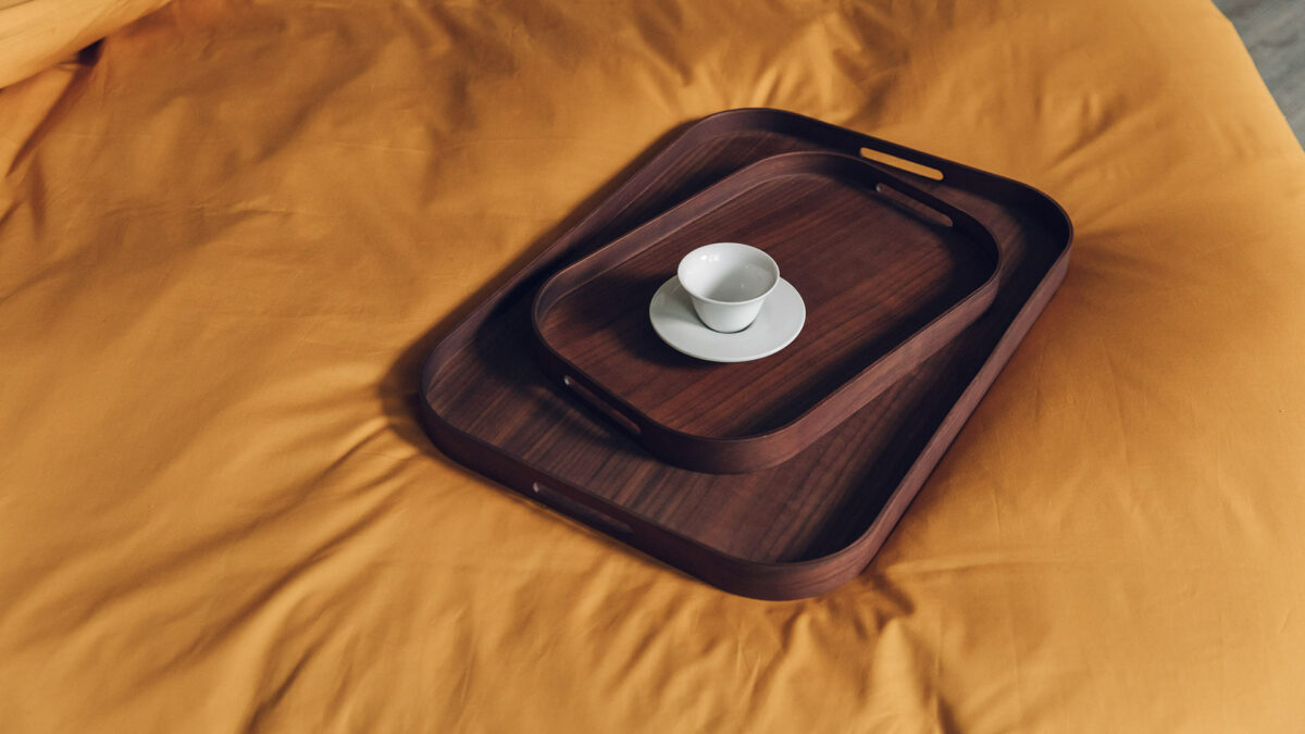 rectangular walnut trays on ochre bedding