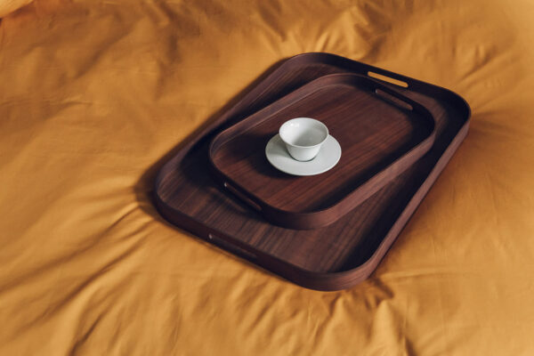 rectangular walnut trays on ochre bedding