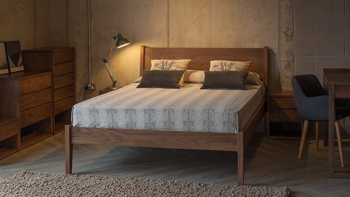 Walnut wooden Zanskar bed with Cube bedroom furniture to match.