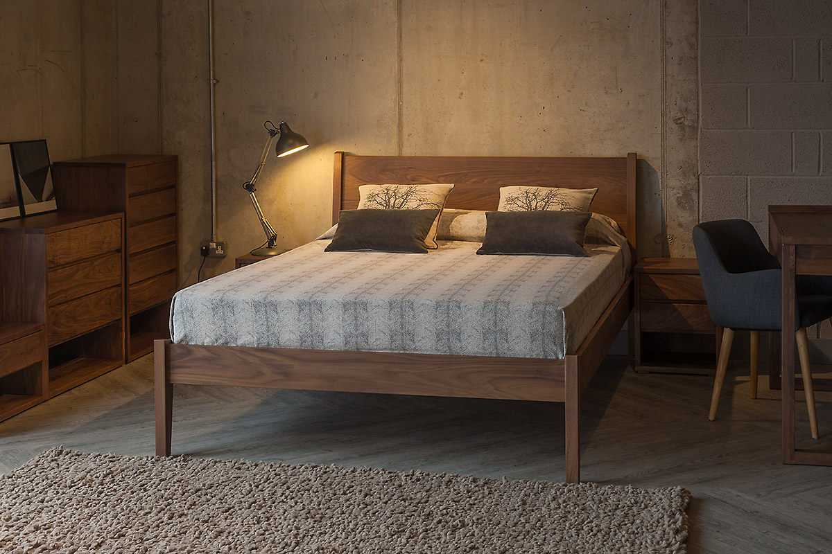 Walnut wooden Zanskar bed with Cube bedroom furniture to match.