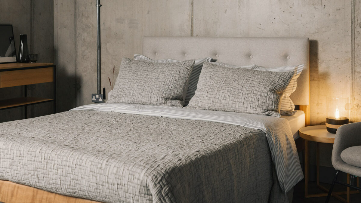 grey textured bedspread with matching pillowcases shown on a Bloomsbury bed