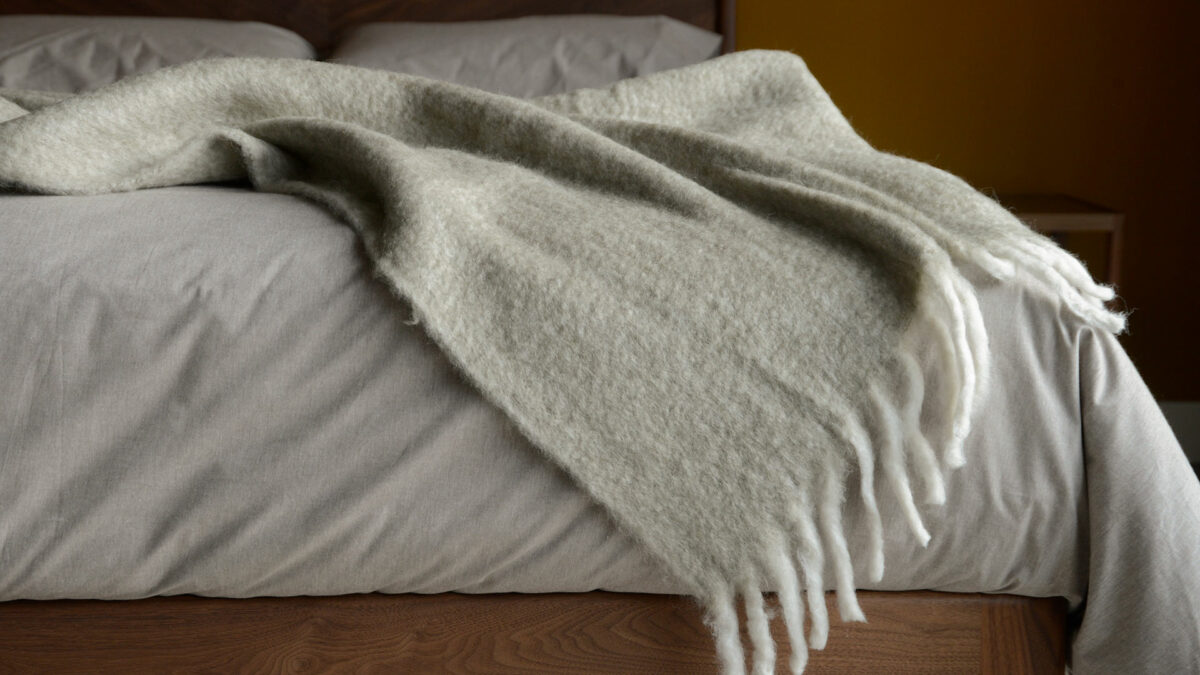 wool blend cosy pale grey throw with white chunky fringes