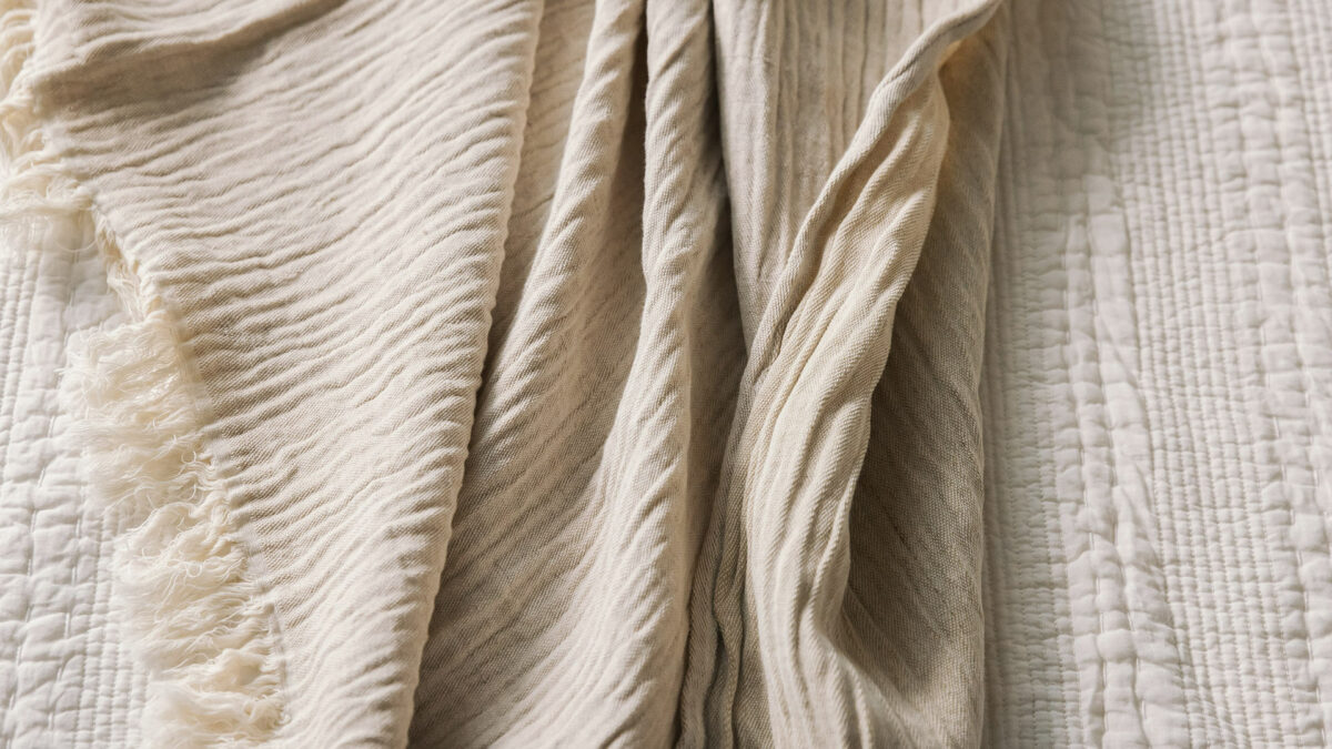 warm stone colour crinkle throw detail