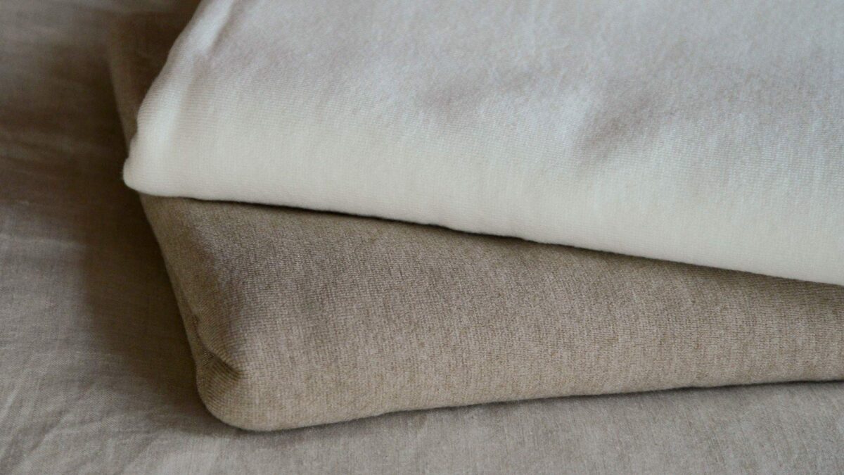 warm white or soft brown fine knit blanket stack