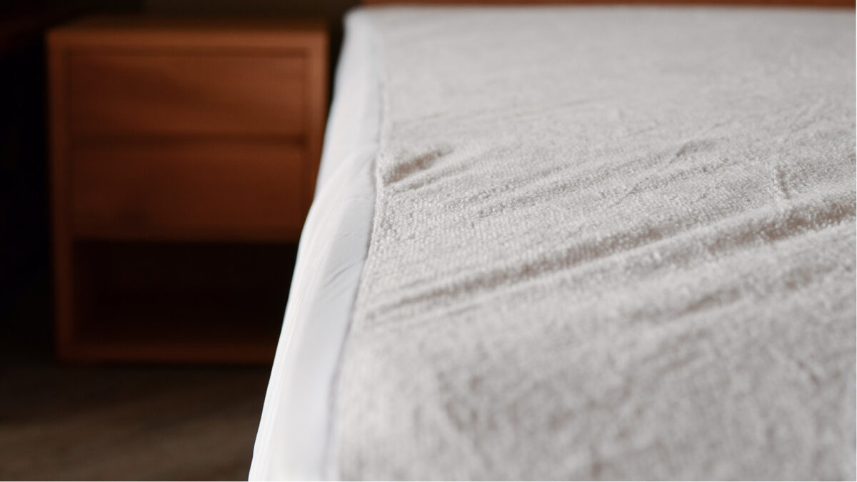 waterproof terry mattress case on bed