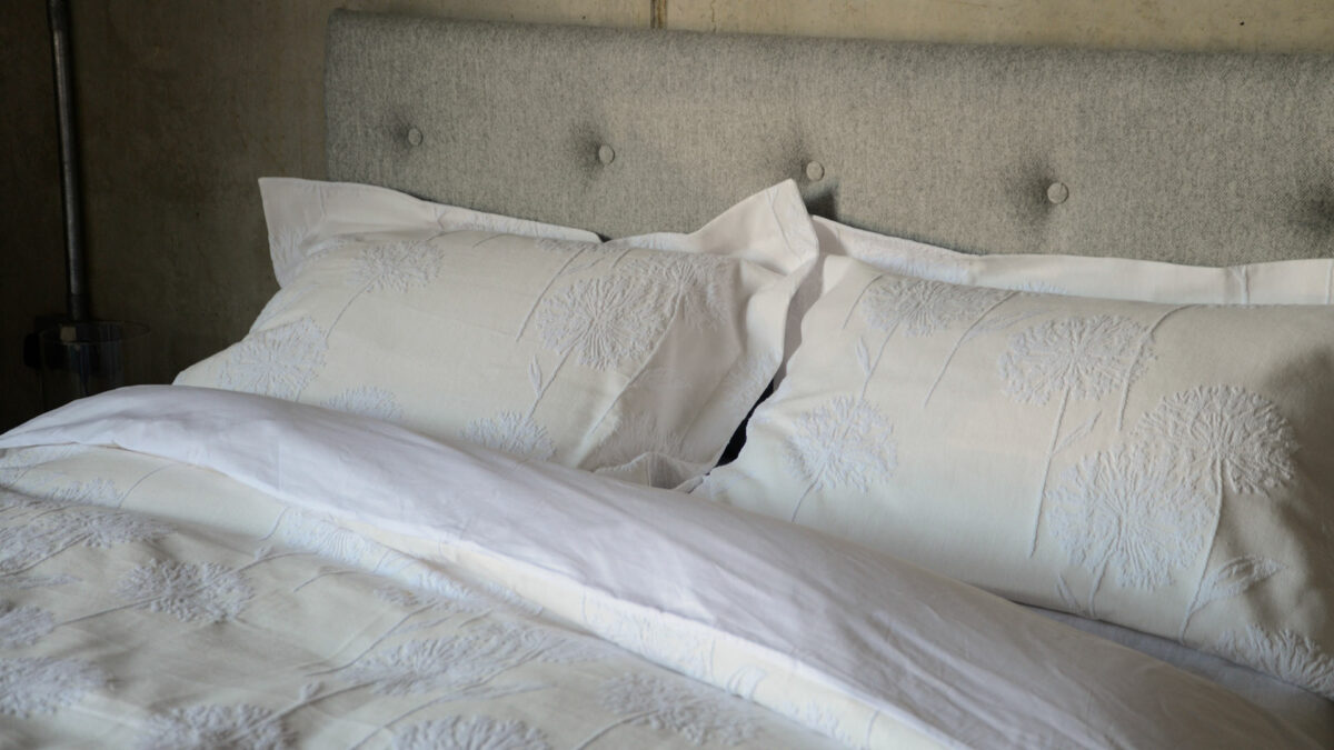 white and cream duvet set with raised allium pattern