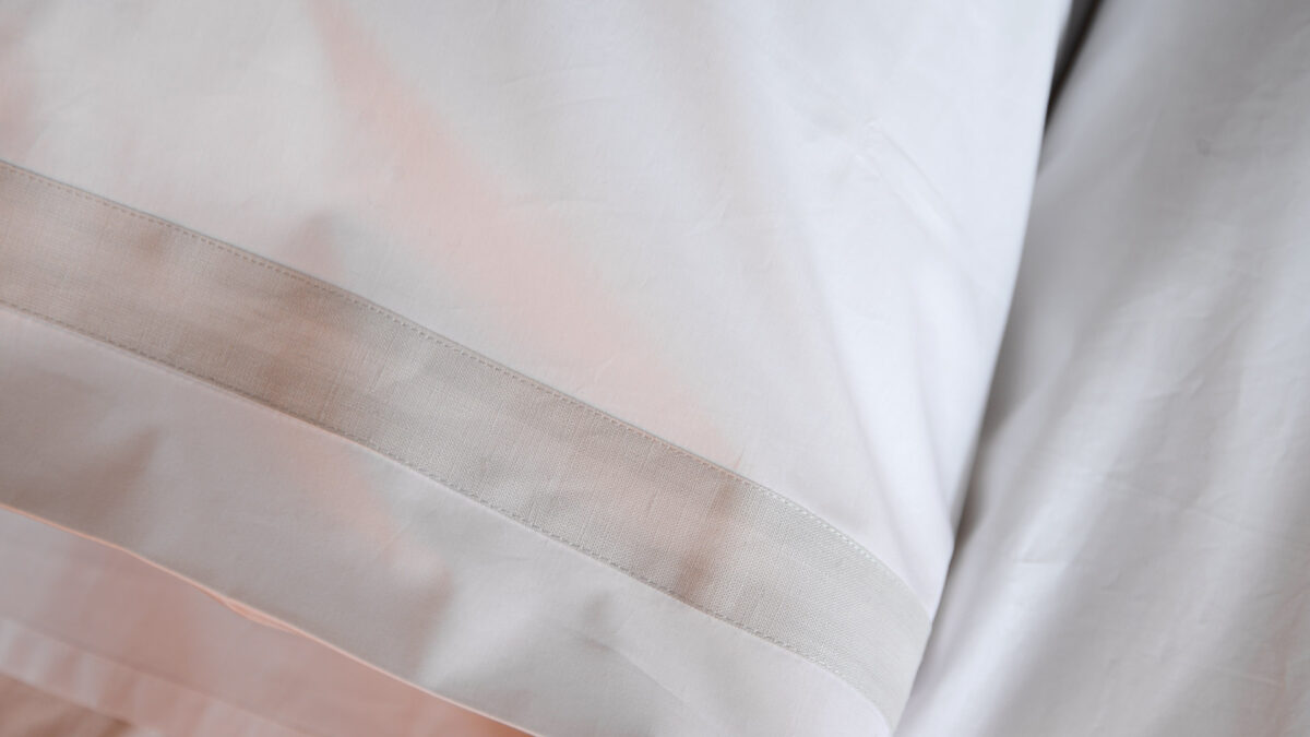 white and silver grey bedding detail