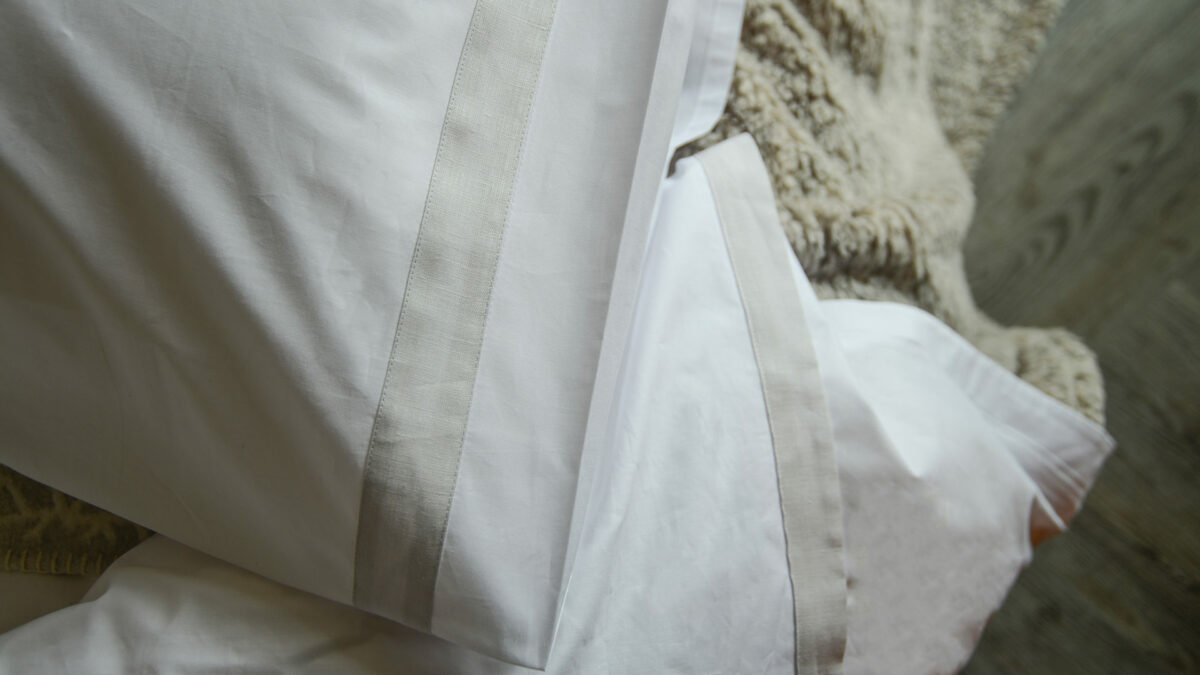 white bedding with silver grey border detail