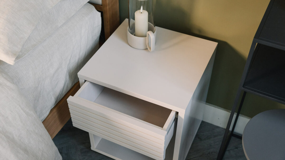 white bedside table with open drawer 1280