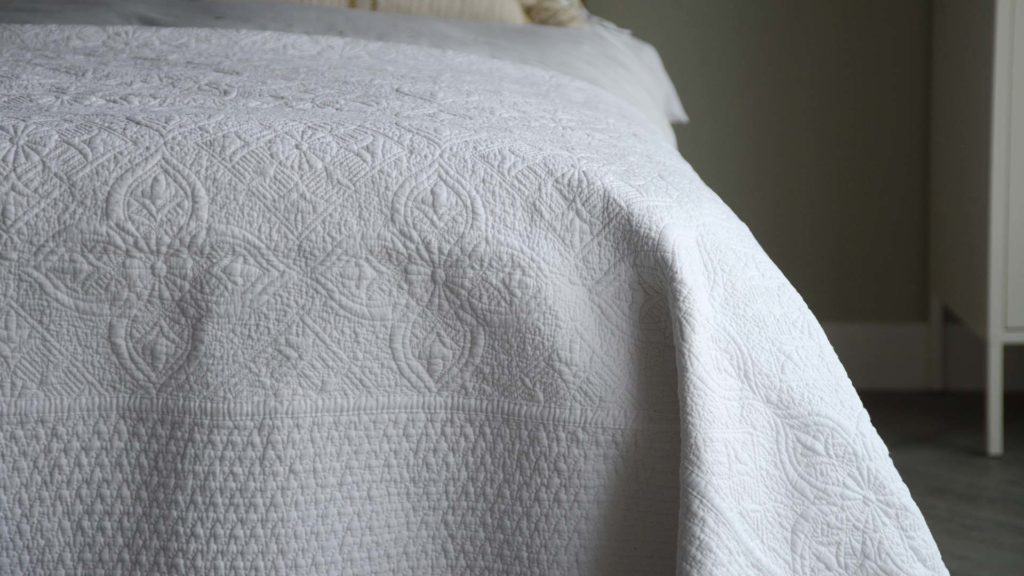 embroidered white bedspread