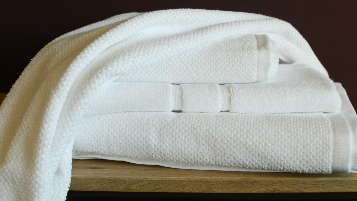 white cotton towels bath mats stack2