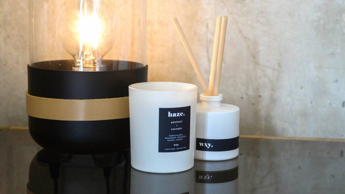 white glass candle and diffuser haze