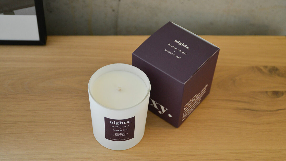white glass scented candle Nights