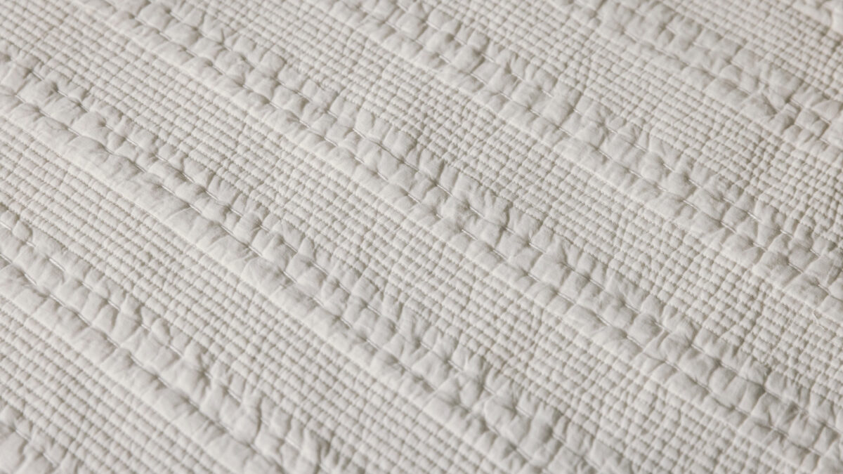 white kantha bedspread detail
