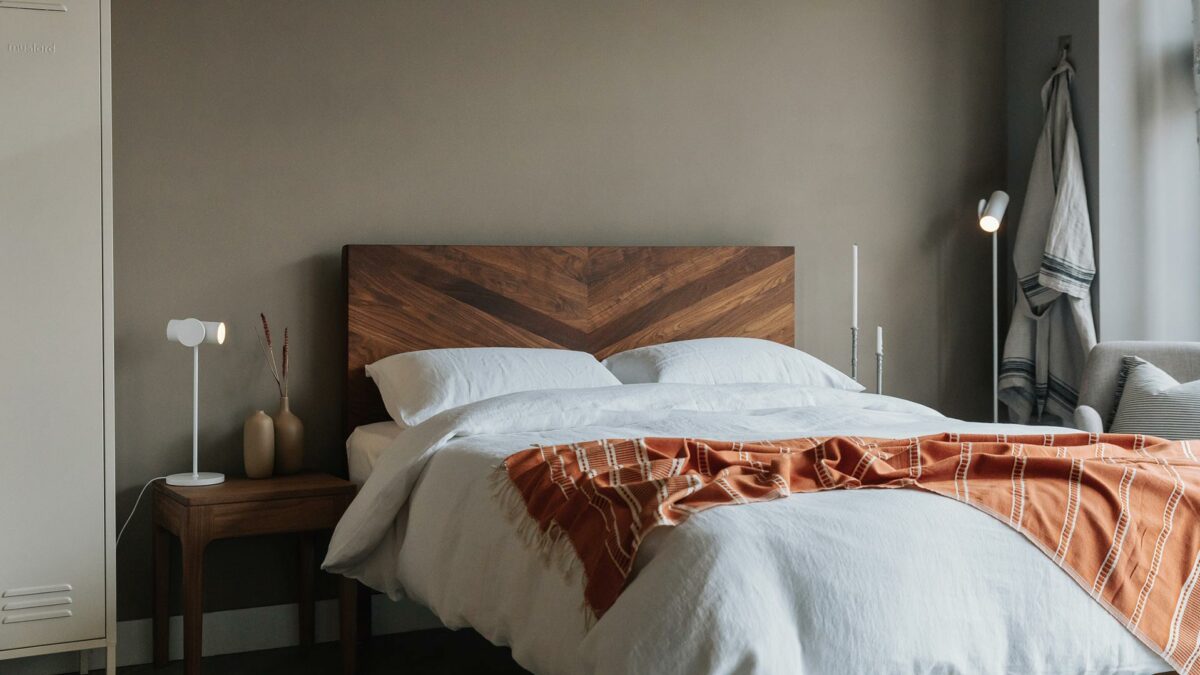 white linen bedding and orange peshtemal