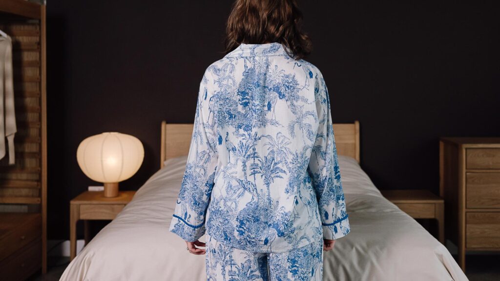back of white and blue pjs with jungle print.