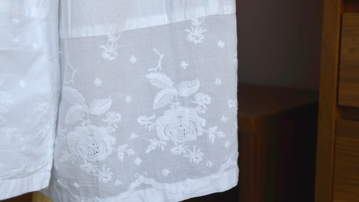 white robe hem detail