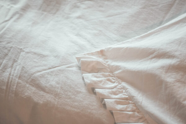 white ruffle cotton bedding close up