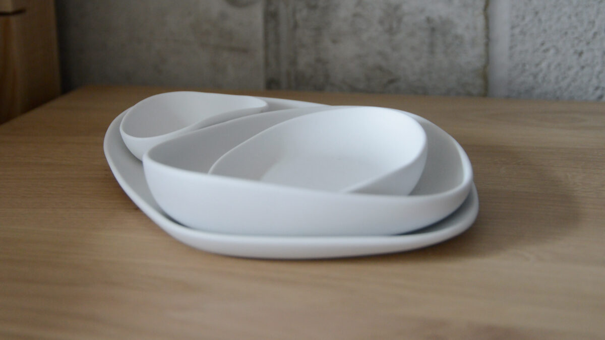 modern irregular shaped dishes set in matt white