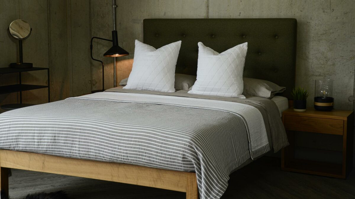 white stockholm cushions and grey stripe bedspread