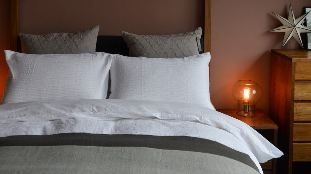 white-textured-bedding-with-grey-accessories