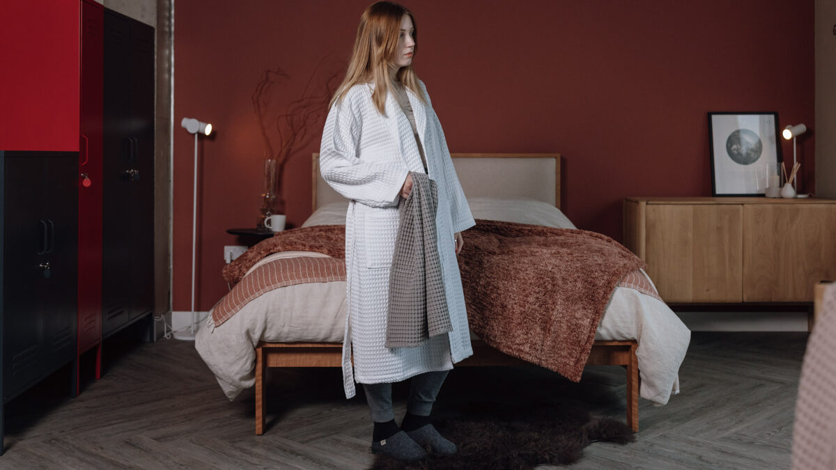 white waffle robe with grey towel