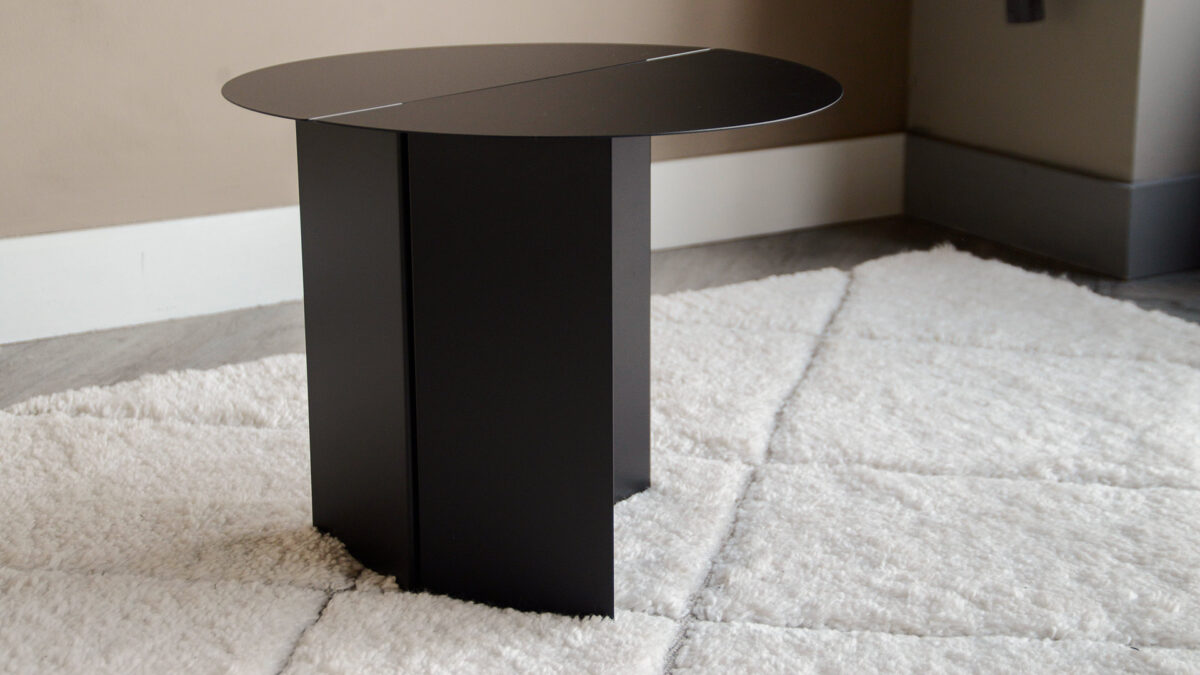wide low black slotted table