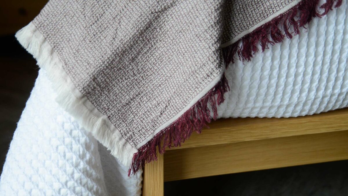 textured weave cotton and linen throw in wine red and ivory