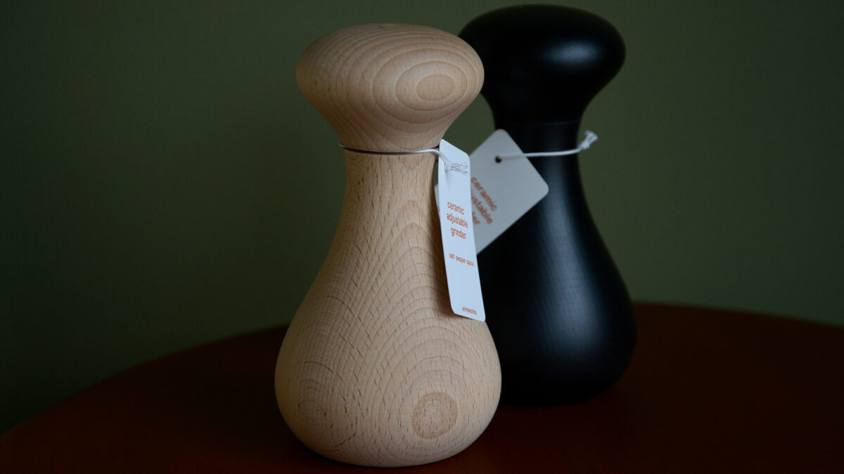 curvy beech wood salt, pepper or spice grinders in natural and black