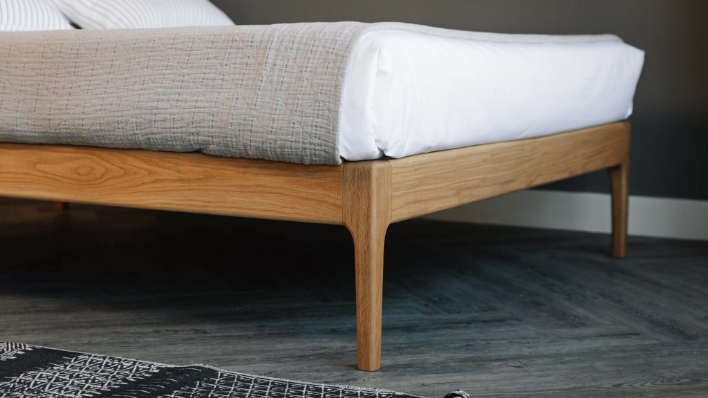 Bloomsbury bed has a hand crafted solid wood frame with curving legs