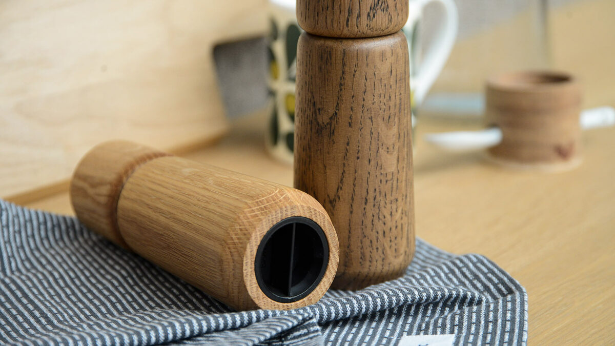 modern wooden salt and pepper grinders showing the underside