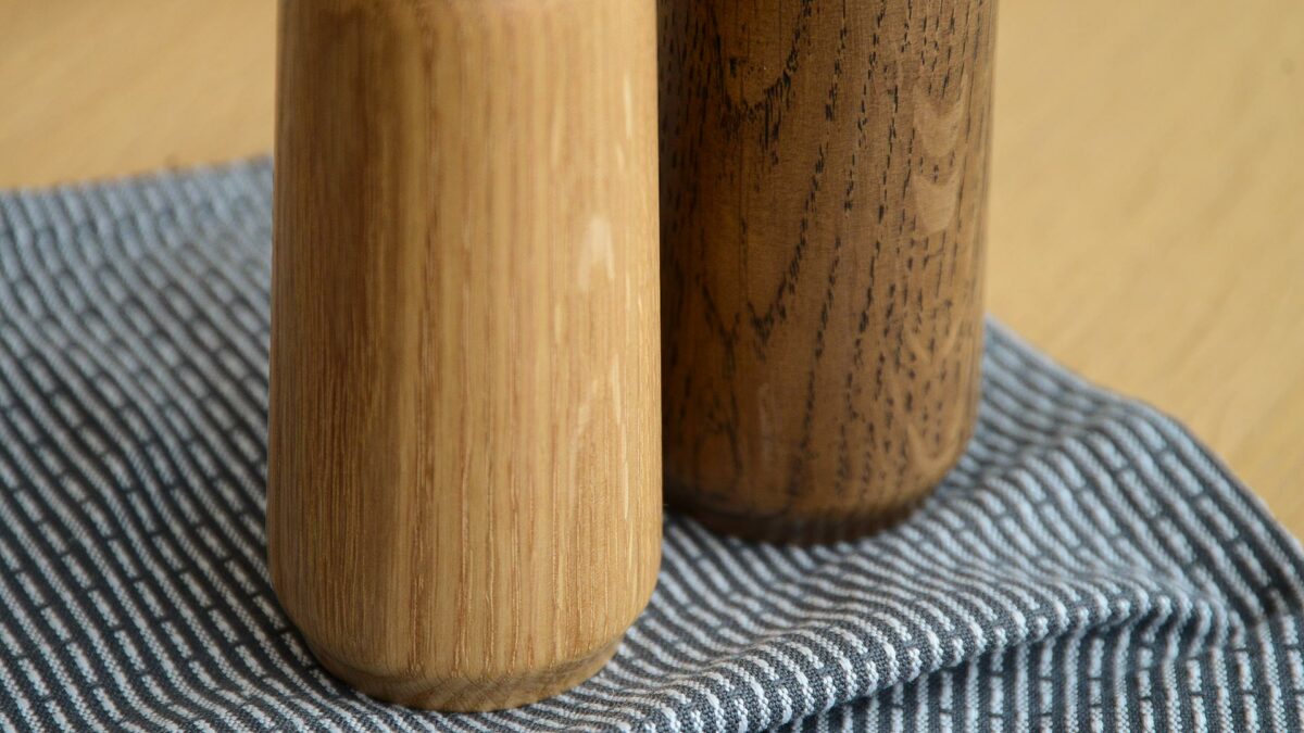 wooden salt and pepper grinders a close up view of the wood grain