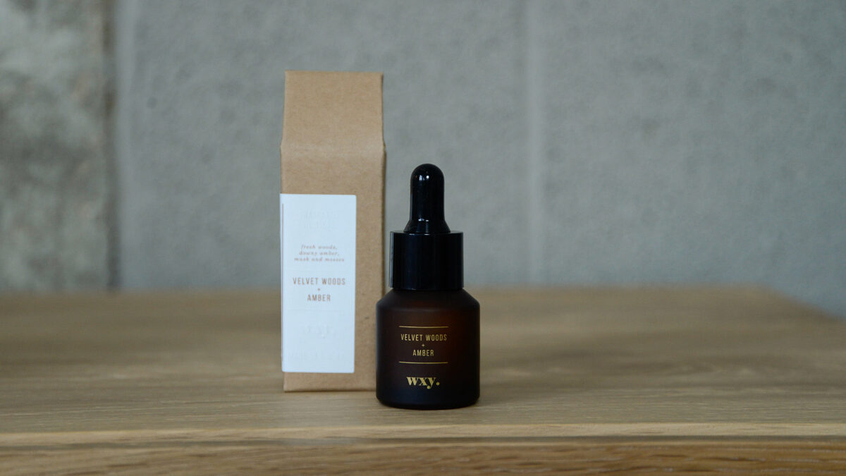 wxy scented oils in amber bottles close up with box