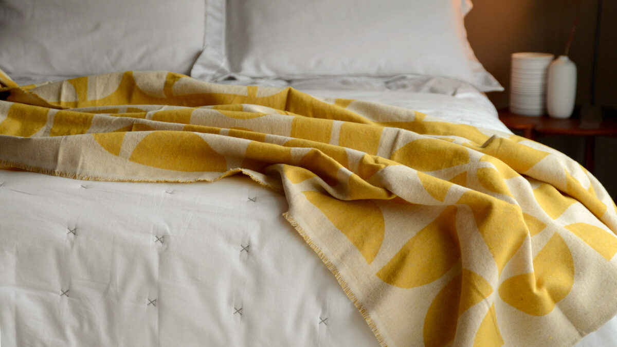 soft cotton graphic design throw in yellow and ecru