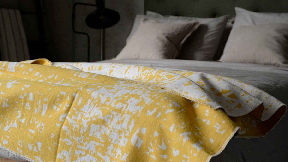 soft recycled cotton reversible throw in yellow and ivory